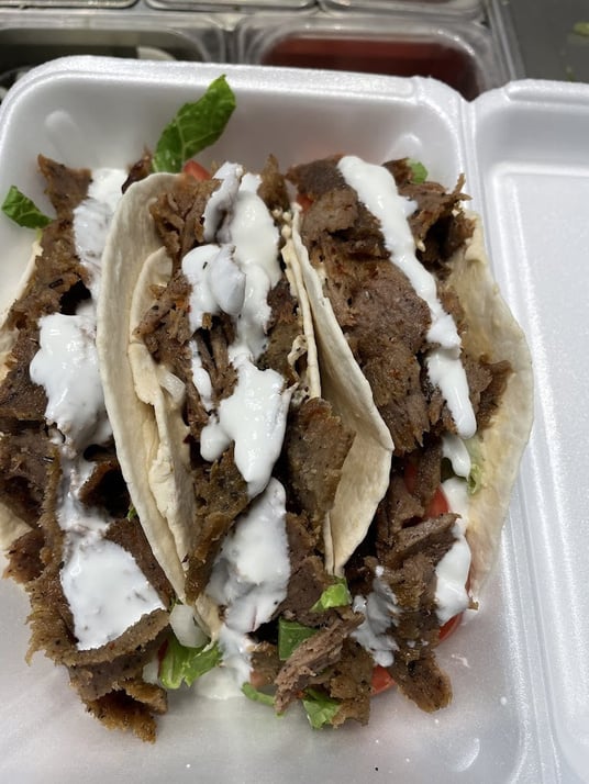 Pita Pocket food truck side view with menu and signage