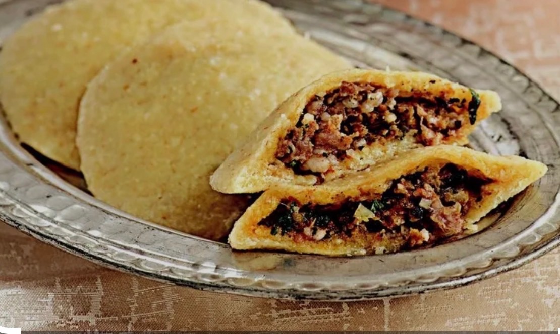 Stuffed meat pies on a silver platter